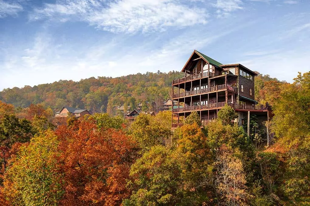 Smoky Mountain cabin on a hill surrounded by fall foliage