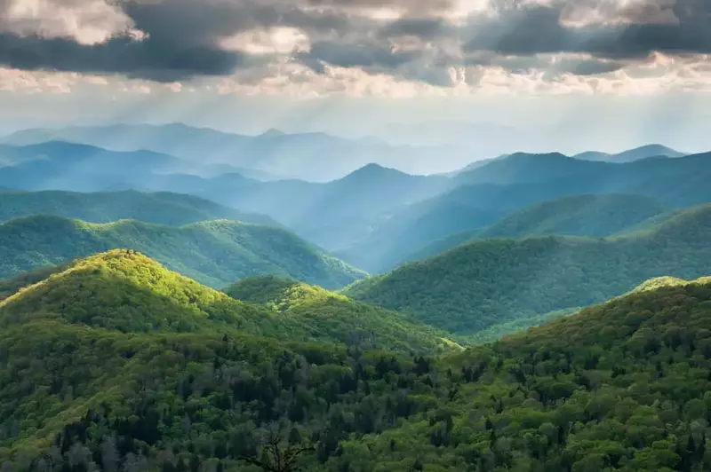 sun shining mountain range in Great Smoky Mountains National Park