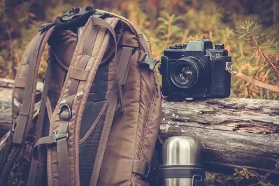 backpack, canteen, and camera