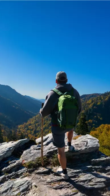 hiker looking out at mountain views